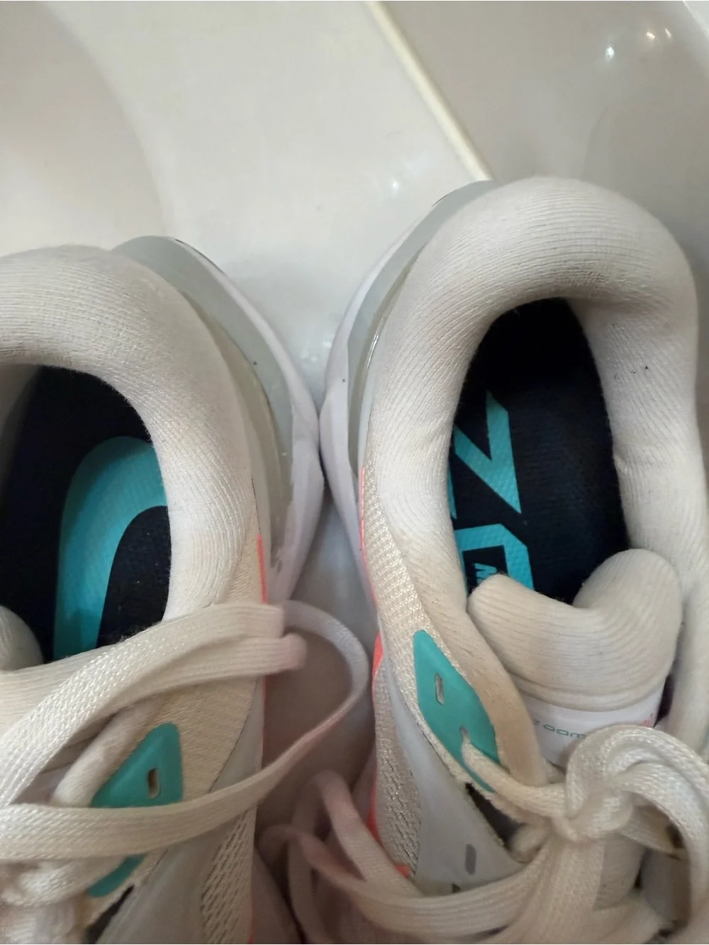 Nike Women’s White Running Shoes with Coral and Teal Accents